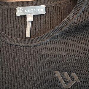 AETHER Women's Black Ribbed Crewneck Top with Subtle Logo